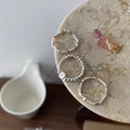 Three beaded rings set with silver beads and pink smiley face charm on marble tray - Colorful Seed Bead, Silver Bead Smiley And Irregular Cut Silver Bead Ring (J4027)