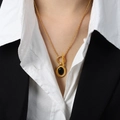 Gold OT clasp necklace with oval black agate pendant worn on a professional outfit - Oval Pendant Necklace (P1889) / Gold / 45cm
