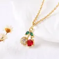Elegant gold-plated cherry pendant necklace with red crystals and white cubic zirconia - Style E-Two-tone Cherry With Zirconia