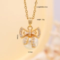 Variante collana fiocco dorato con intarsio in zircone e un elegante ciondolo di perle - Oro
