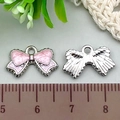 Pink glitter enamel bow alloy pendant with silver backing and 2.5cm width measurement - 1Pc Pink Glitter Bowknot