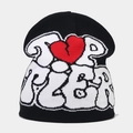 Détail du bonnet Top User avec motif cœur rouge brisé et lettrage blanc en relief - Noir