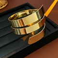 Modern triple-layer spiral gold cuff bracelet with a polished finish and open design - Spiral Wide Bangle / Gold