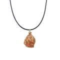 Close-up of a raw citrine stone pendant wrapped in gold wire with a black cord necklace - Red Agate