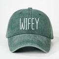 Close-up of washed green cotton baseball cap with white WIFEY printed text detail - Dark Green