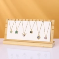 Bamboo necklace display stand featuring diverse colorful heart and floral pendants - ZM009 Small White PU Leather