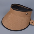 Detail view of woven linen straw sun visor with black trim and silver metal logo emblem - M (56-58cm) / Khaki