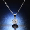 Macro detail of S925 sterling silver sun flower necklace with moissanite center stone - Q004 Sunflower 0.5ct