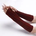 Close-up of dark red cable knit fingerless gloves with thick textured pattern and thumb hole - Burgundy