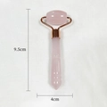 Pink resin facial roller with rose gold metal parts and clear size dimensions - Pink