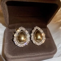 Close-up of teardrop pearl earrings with zircon inlay on silk background in a box - Gold Grey Teardrop