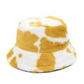 Detailed view of plush cow print bucket hat featuring thick yellow and white faux fur - M (56-59cm) / Yellow