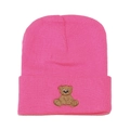 Close-up of pink knit beanie showing fine texture and cute brown bear embroidery - Rose Red