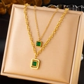 Gold double-layered necklace featuring emerald square pendants on a jewelry display box - Double Layer Square Necklace (N2468)