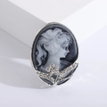 Retro queen relief brooch in silver alloy with rhinestone floral accents on white background - Silver