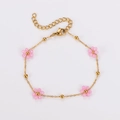 Vintage style gold beaded bracelet featuring pink flower charms with adjustable chain - Pink-Bracelet