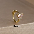 Macro shot of 8mm gold butterfly huggie earring with pink and white zirconia stones - 8mm / Gold-Pink