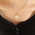 18K gold Sagittarius constellation necklace with white shell pendant on a model - Gold Sagittarius