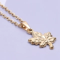 Macro shot of 18k gold plated maple leaf pendant with detailed leaf veins on O-chain - Gold (Necklace)