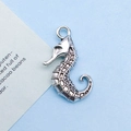 Antique silver seahorse charm pendant for DIY jewelry making on blue background - 15x22mm / Antique Silver Seahorse