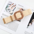 Detail of bohemian woven straw belt featuring a large square wooden buckle on a magazine - Square Buckle White