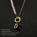 Stainless steel letter U pendant necklace with gold chain and high-luster faux pearls - Gothic Letter V