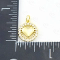 Golden heart pendant with sparkling zircon inlay and measurement scale on white background - Heart