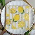 Single-ply printed paper napkin with lemon pattern and yellow stripes on a lace plate - Lemon Stripes (1105)