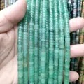 Macro detail of natural green gemstone spacer beads for DIY jewelry making and crafting - Green Aventurine