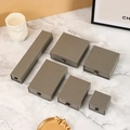 Dark grey drawer-style jewelry gift box set arranged on a marble surface - Gray; 12*8*3cm