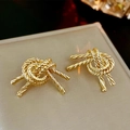 Macro shot showing detailed twisted gold rope knot earrings with high-polish metallic finish - Gold (S925 Silver Pin)
