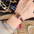Luxury gold square watch with a red dial and red leather strap on a woman's wrist - Gold/Red (Square Vintage)