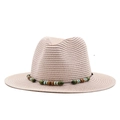 Detail of beige straw fedora featuring multi-colored bead band and textured weave - Nude Pink