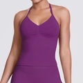 Detail of purple halter yoga top showing seamless ribbed fabric and chest ruching details - Plum Purple