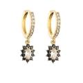 Detail of gold hoop earrings with white oval gemstone and black flower petals - White And Black