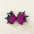 Detail of Halloween bow hair clip featuring purple glitter spider web and a black spider - Purple Spider Bow