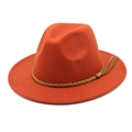 Detail of orange wool fedora hat featuring a brown braided leather band and tassel - M (56-58cm) / Caramel color