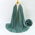 Long green pearl chiffon scarf displayed on a mannequin with fabric texture detail - Green