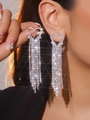 Sparkling silver heart earrings with long rhinestone tassels shown on a model - Silver Full Rhinestone Tassel Heart Style (DTE1816368S)
