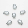 Macro shot of 10x14mm fish-shaped glass beads with embossed scale texture and center holes - Light Blue Grey