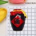 Miniature resin Chinese wine jar magnet with red tassel and size scale detail - A Jar of Wine
