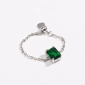 Detail of adjustable chain ring with emerald-cut green zircon and heart pendant - Green Zircon - White Gold