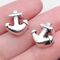Silver anchor charm pendant accessory held in hand to show fine polished metallic details - 1pc Anchor Large Hole Bead