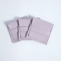 Three light purple microfiber jewelry pouches with flap closure on white background - Purple