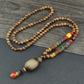 Ethnic style long necklace with wooden prayer beads, vintage pendant and colorful tassels - Green Brushed Cylinder
