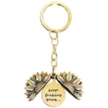 Detailed close-up of a metal sunflower keychain with an opening locket and engraved quote - T00002 Full Gold (Keep fucking going)