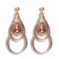 Macro detail of Bohemian wire-wrapped heart earrings with amber teardrop gemstones - Water Drop Double Layer