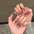 Macro detail of long stiletto press-on nails with brown cat eye effect and crystal gems - Handmade Nails (Size M/10 Pieces Pack) / Elegant and Dignified