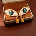 Details von Vintage Evil Eye Ohrringen mit blauem Herz und bernsteinfarbenem Tropfen - Augenform mit Wassertropfenanhänger / Gold mit Blau und Bernstein