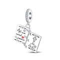 Macro detail of silver charm engraved with All we need is peace and a red heart - PAC1328-Book of Peace Dangle